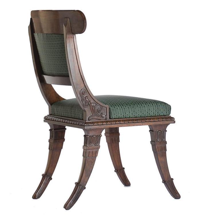A set of four Regency carved rosewood side chairs.
