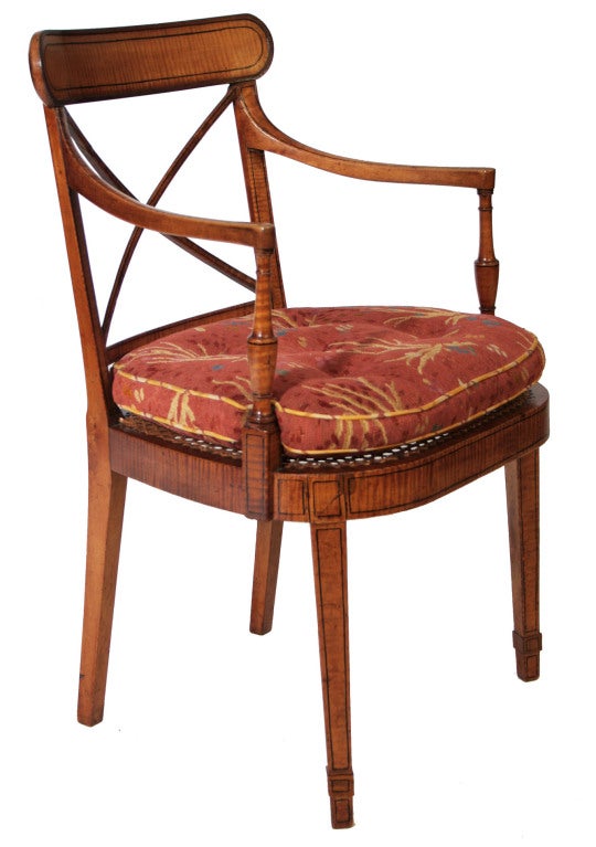A set of four George III tiger maple open armchairs.