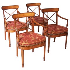A set of four George III tiger maple open armchairs.