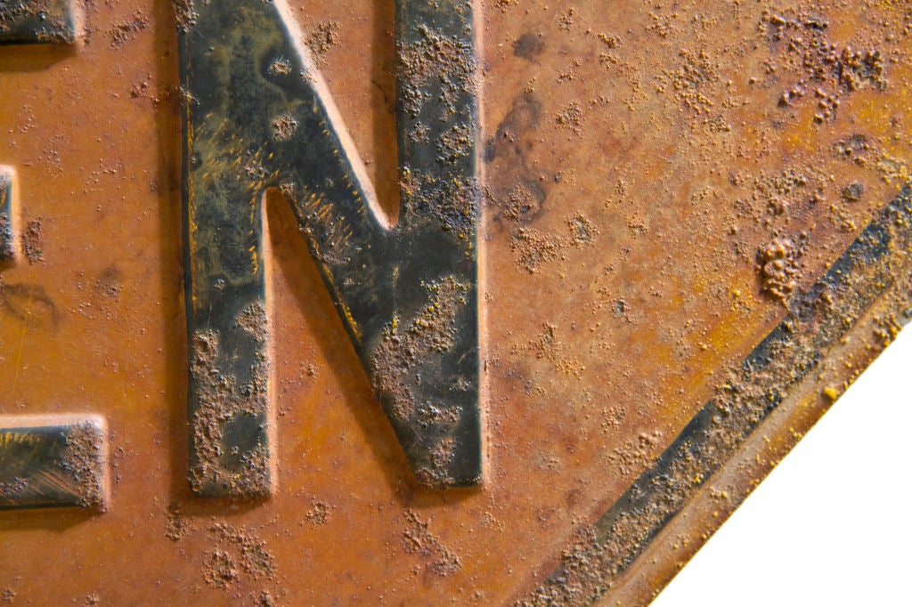 Early 20th century sheet steel road sign on original cast iron pipe and base.  Midwest origin.  Yellow/orange background with black painted raised letters.  A stunning warning for today's world.