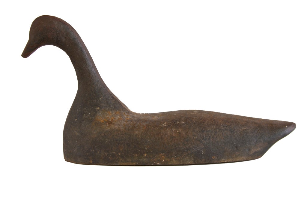 The use of sink box decoys was banned in the United States with the passage of the Migratory Bird Act of 1918.  Cast iron sinkbox decoys were used as ballast to disguise the sinkbox and attract game close to the hunters.  This particular example is