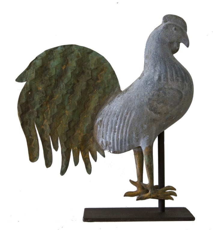 Howard made very few of these small rooster weathervanes and, as such, they are highly prized by collectors.  This particular example, in excellent condition, shows pleasing age patination and verdigris from its years of exposure.