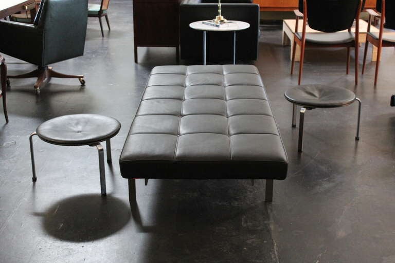 A matching pair of black leather PK33 stools designed by Poul Kjaerholm for Fritz Hansen. Priced and sold individually.