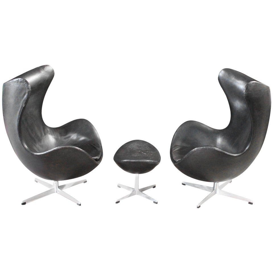 Pair of Leather Egg Chairs and Ottoman by Arne Jacobsen