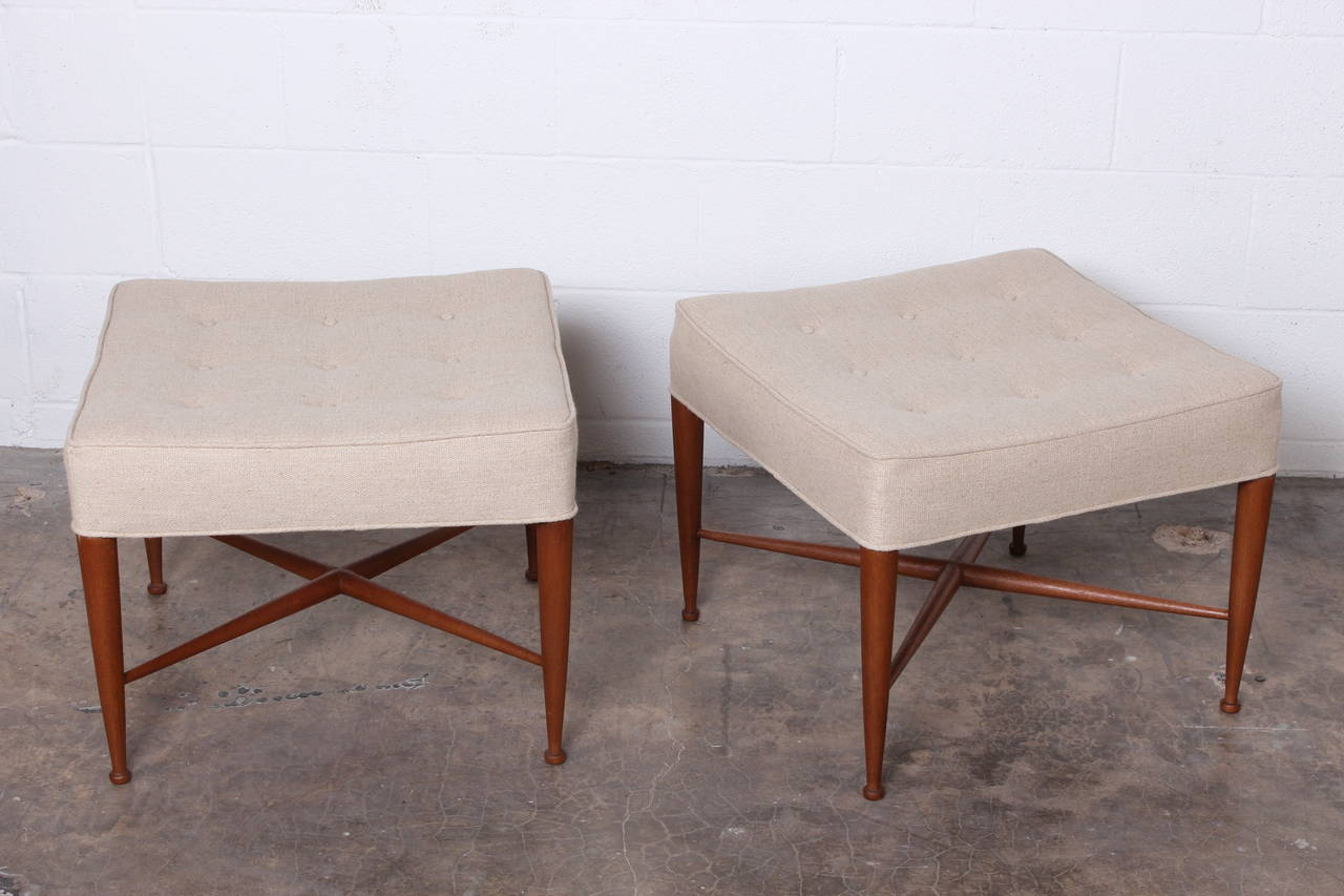 A pair of mahogany Thebes ottomans designed by Edward Wormley for Dunbar.
