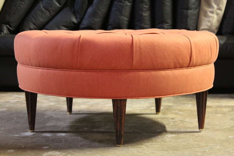 A rare tufted ottoman with solid rosewood fluted legs and brass tips. Designed by Edward Wormley for Dunbar.