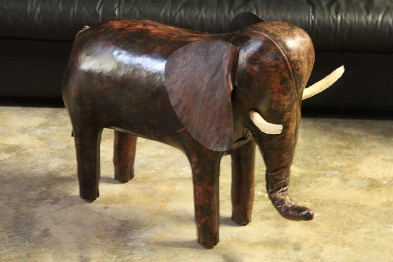A large scale leather elephant ottoman designed by Dimitri Omersa for Abercrombie & Fitch.