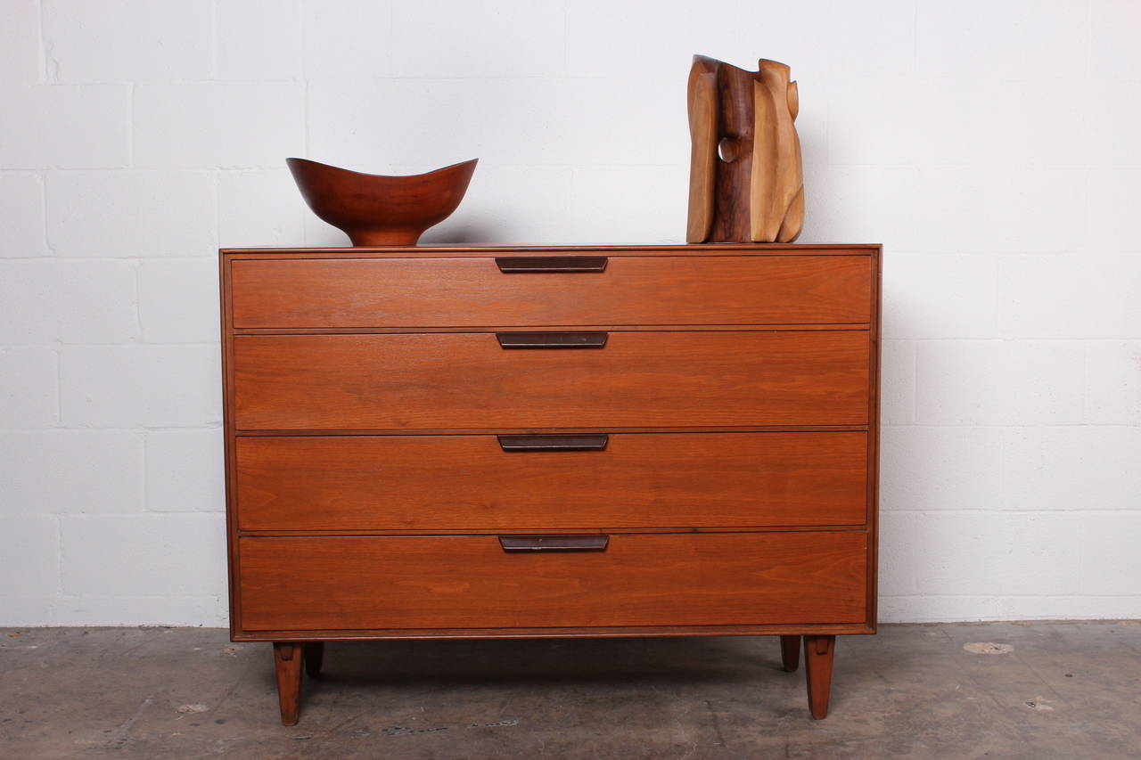 A large teak bowl with heavy patina and one repaired crack as shown in photo. Designed by Finn Juhl.