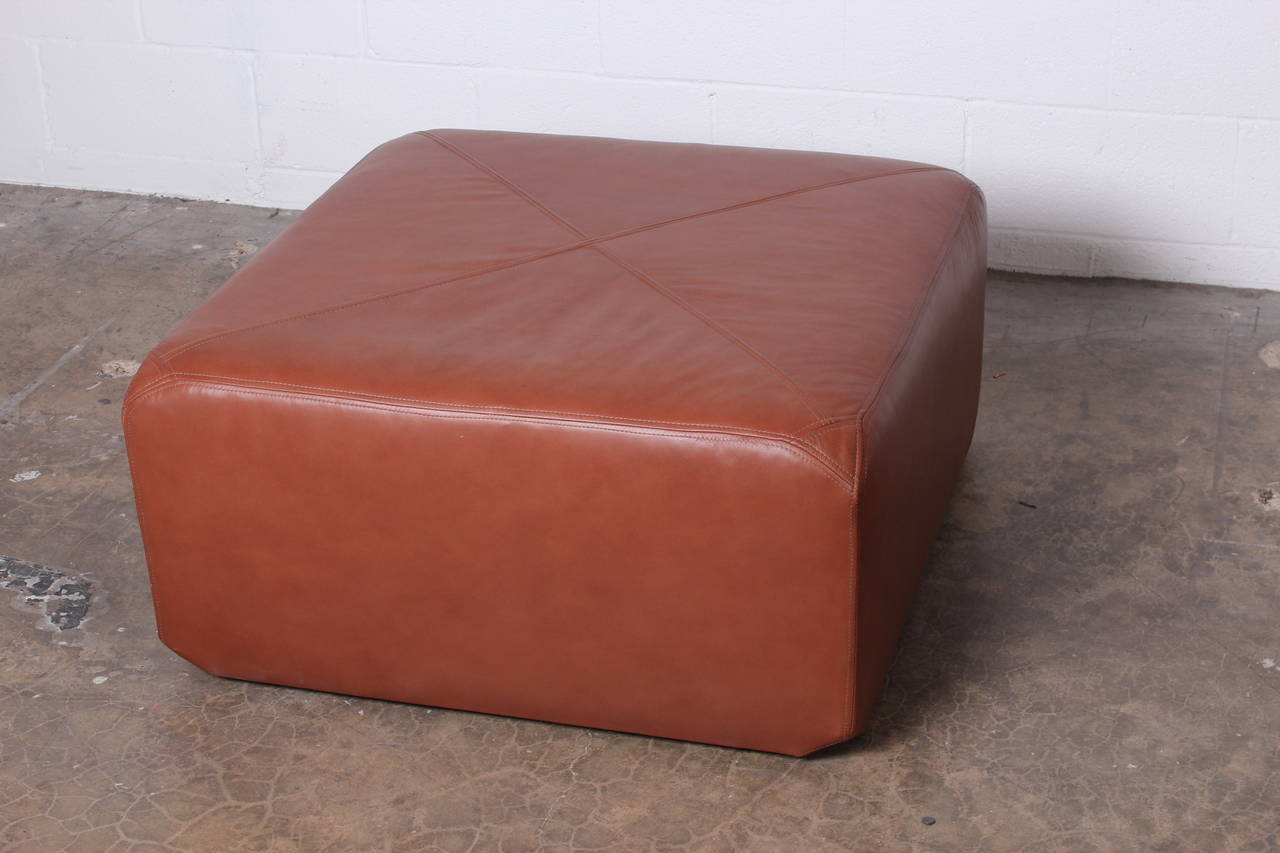 A rare ottoman on casters in original leather. Designed by Edward Wormley for Dunbar.
