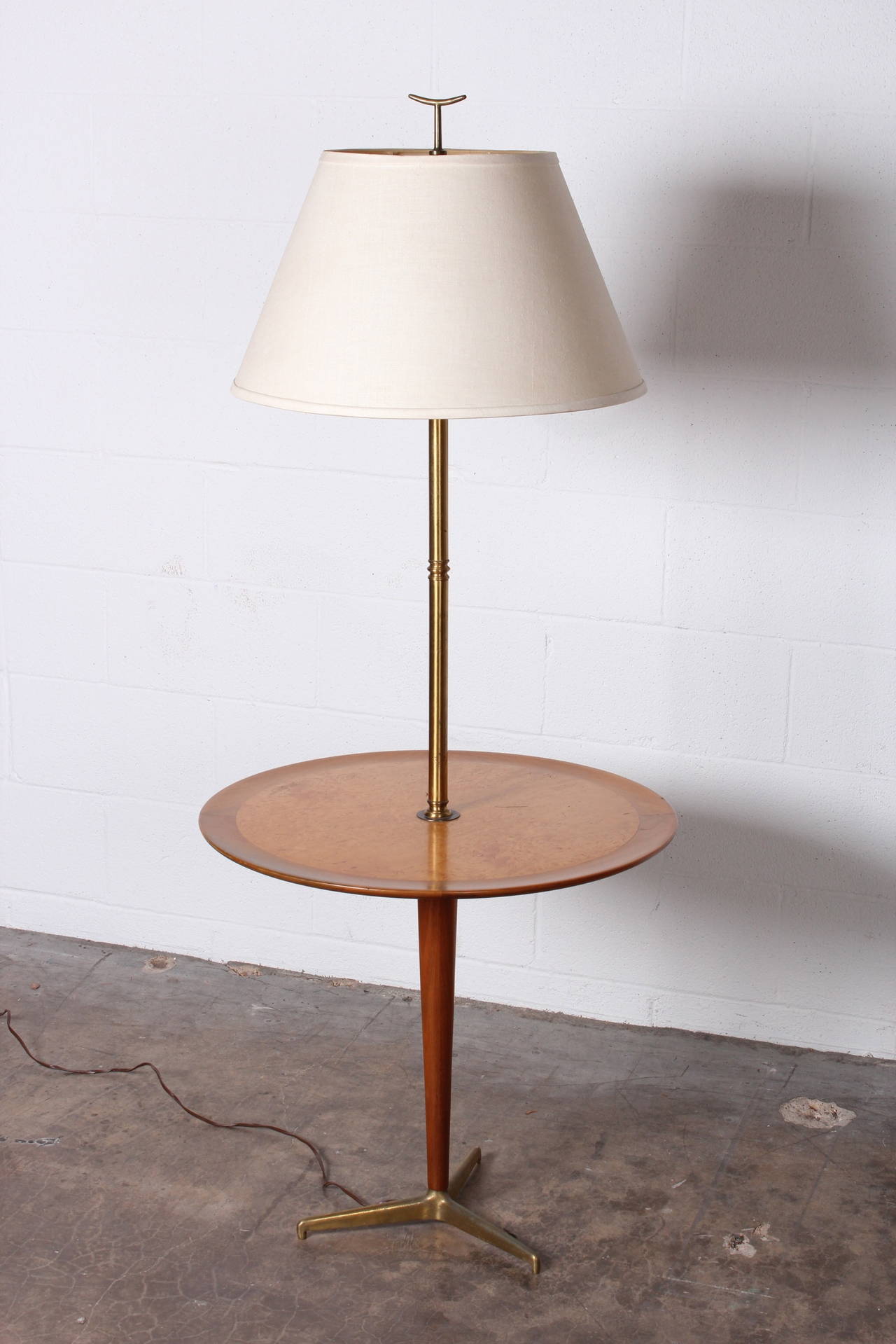 A rare floor lamp with attached table. Designed by Edward Wormley for Dunbar.