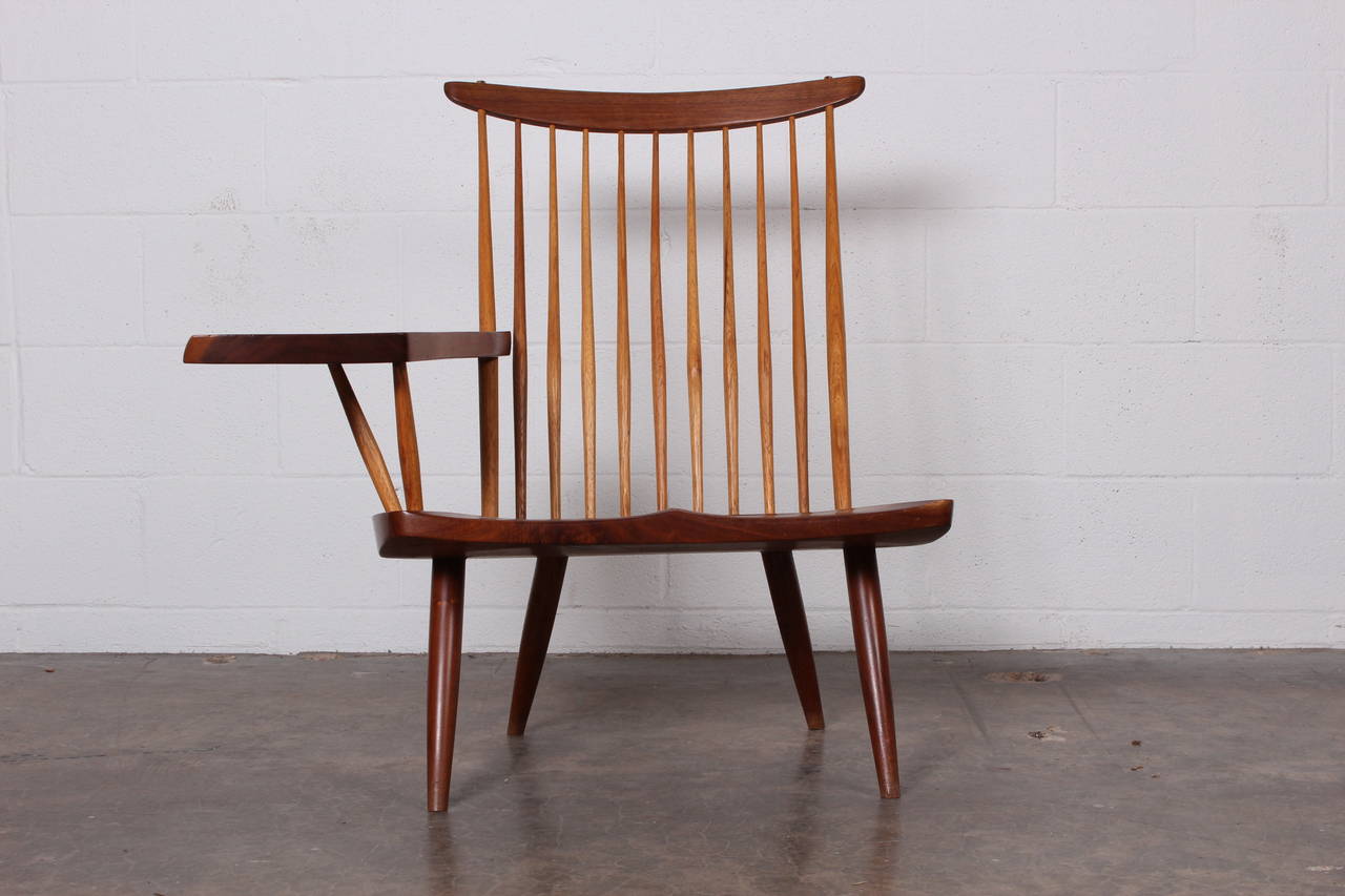 Beautiful and expressive single slab-arm lounge chair from George Nakashima. Chair signed 