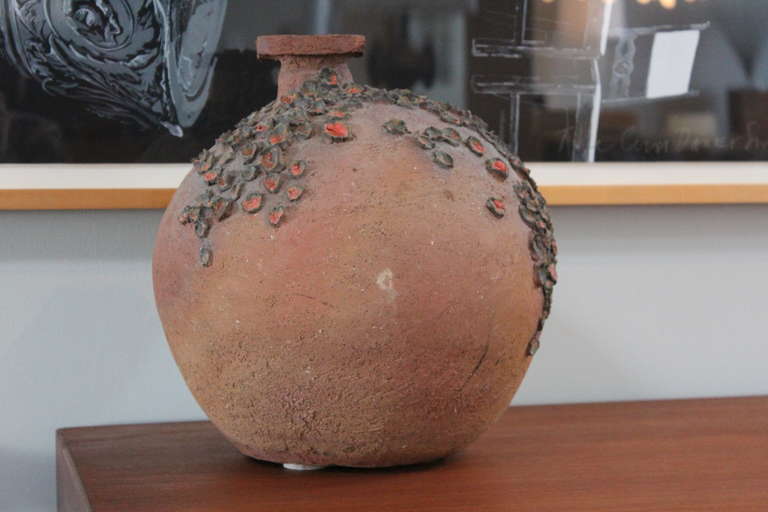 A large stoneware vase signed Jarvis.