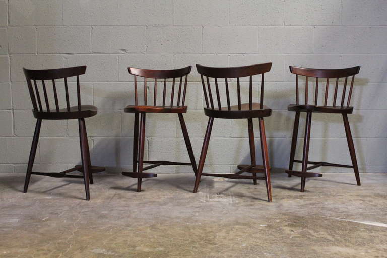 A set of four counter-height stools by George Nakashima.