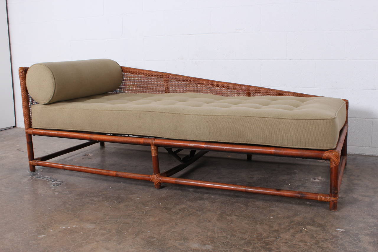 An asymmetrical bamboo daybed designed by Tommi Parzinger for Willow and Reed.