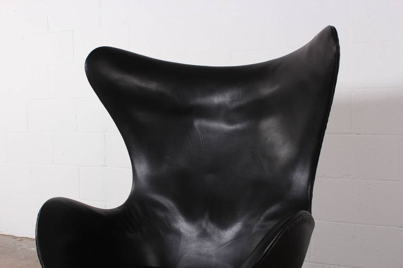 An egg chair by Arne Jacobsen for Fritz Hansen in original black leather.