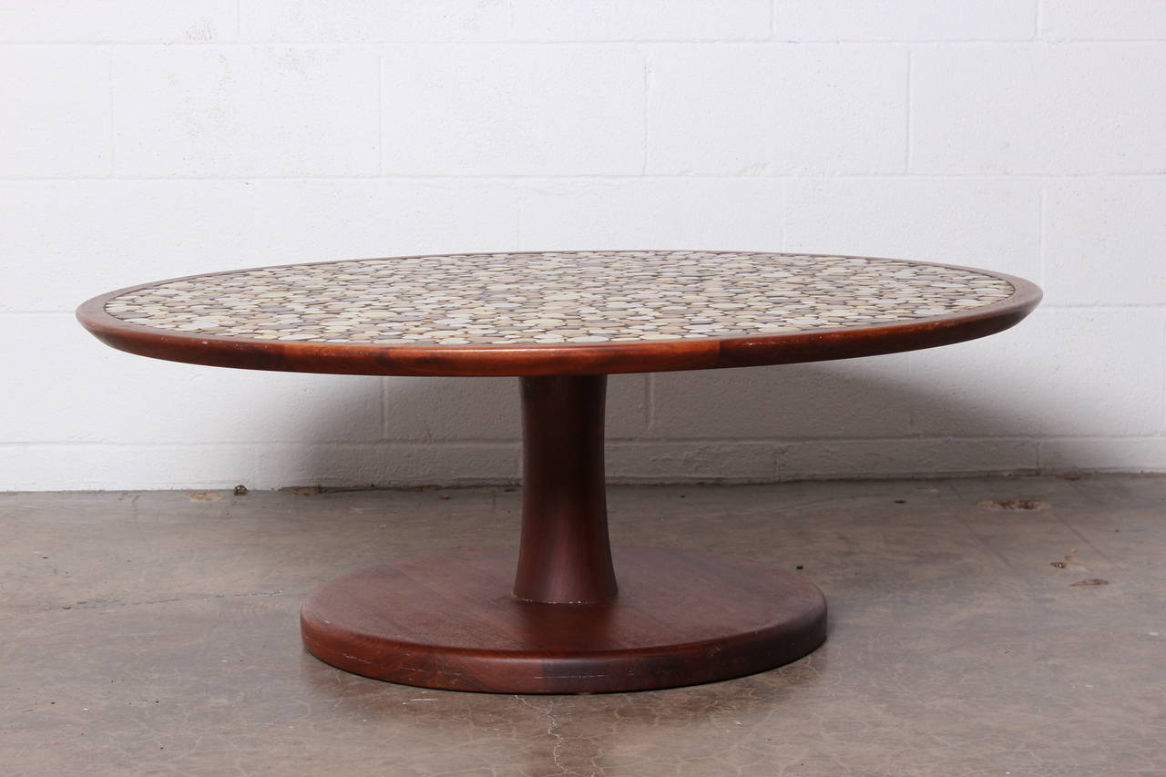 A walnut coffee table with ceramic tile top designed by Gordon & Jane Martz for Marshall Studios.