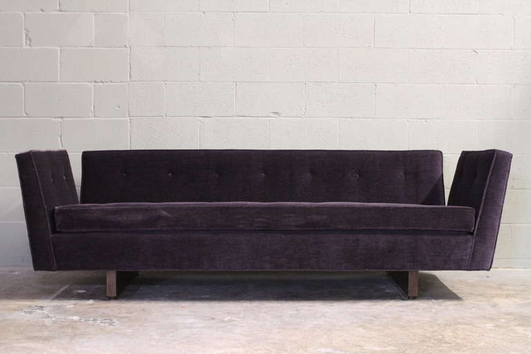 A beautifully restored split arm sofa with walnut base. Designed by Edward Wormley for Dunbar. A second larger sofa also available.
