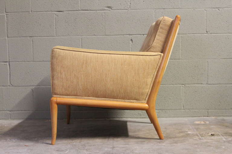 Upholstered lounge chair with bleached walnut frame. Designed by T.H. Robsjohn-Gibbings for Widdicomb.