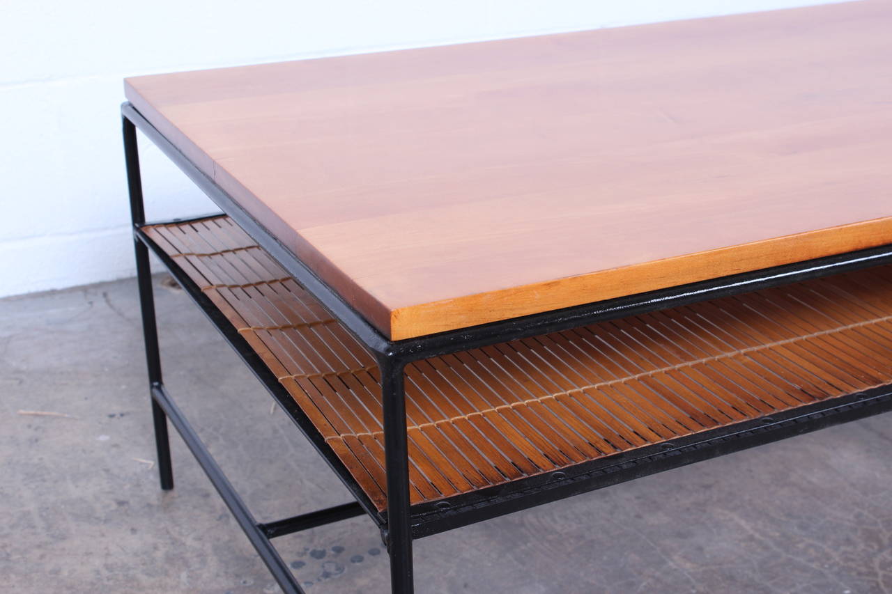 A maple and iron coffee table designed by Paul McCobb for Winchendon.