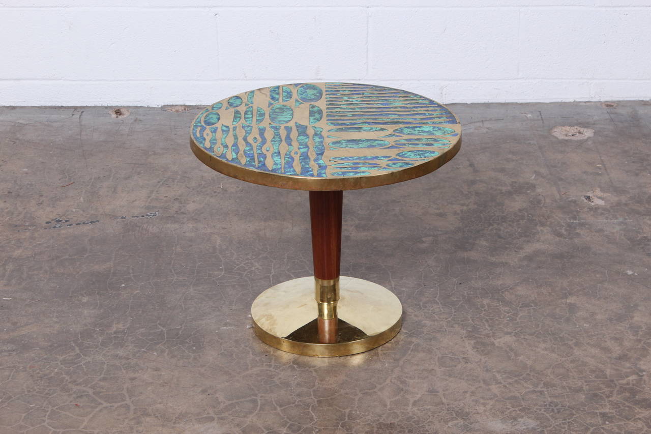 A rare and large table with brass and walnut base by Pepe Mendoza.