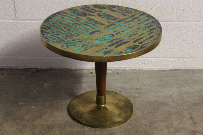 A rare and large table designed by Pepe Mendoza. Made of solid brass, walnut and a composite.