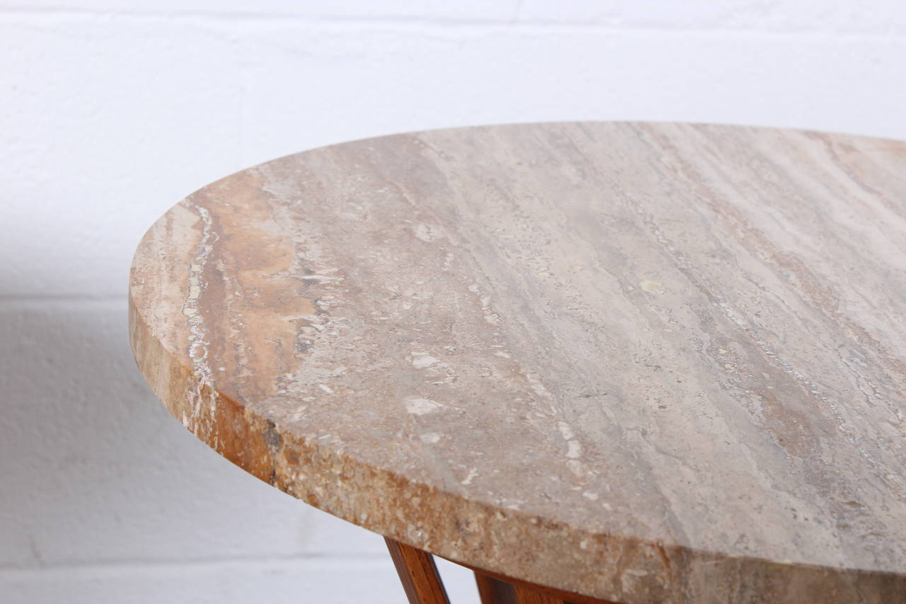 A matching pair of travertine top tables designed by Edward Wormley for Dunbar.