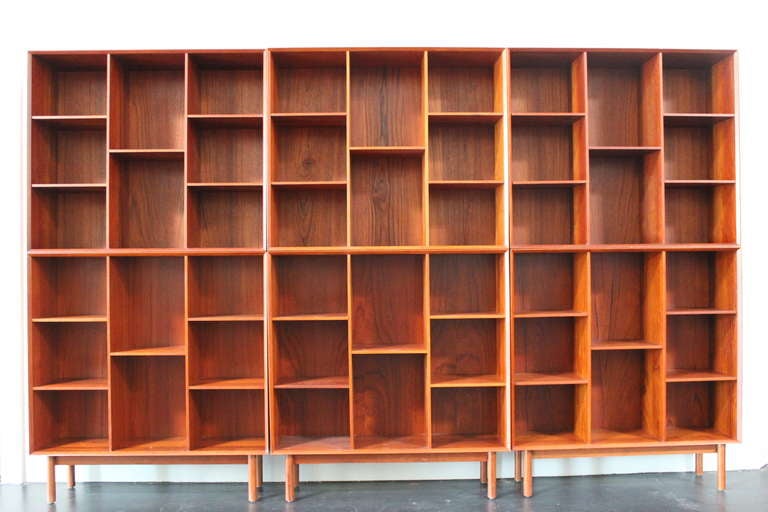 Impressive set of six teak bookcases designed by Peter Hvidt. Each with exposed finger joints and adjustable shelves. 