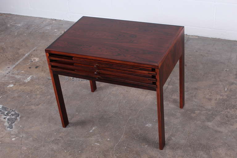 A rare set of rosewood folding tables designed by Illum Wikkelso.