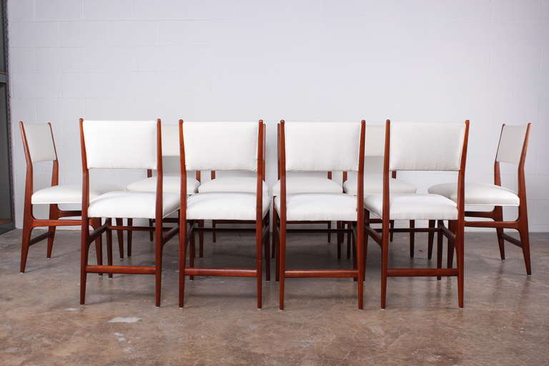 A set of ten walnut chairs designed by Gio Ponti for Cassina.