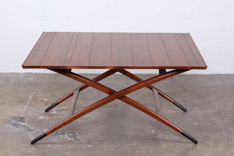 A rarely seen adjustable height folding table designed by Edward Wormley for Dunbar.