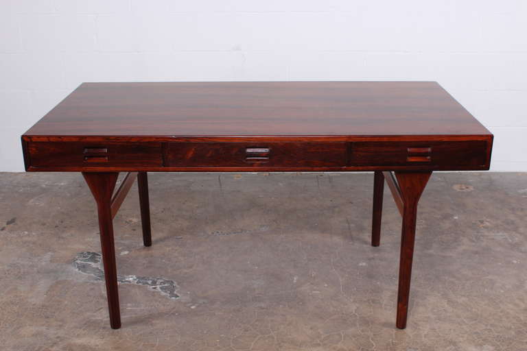 A rare three drawer rosewood desk designed by Nanna Ditzel.