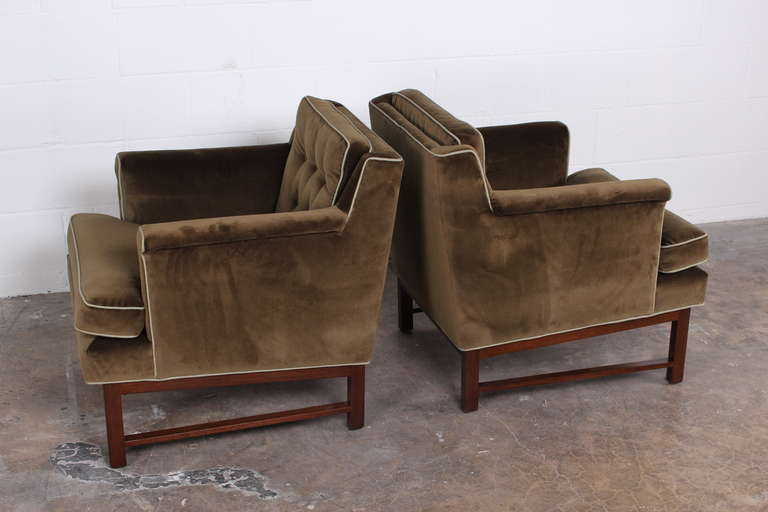 A pair of very comfortable lounge chairs with mahogany bases. Designed by Edward Wormley for Dunbar.