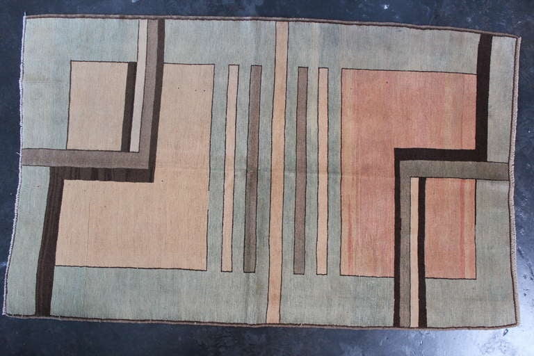 A nicely patinated Turkish rug with cubist pattern.