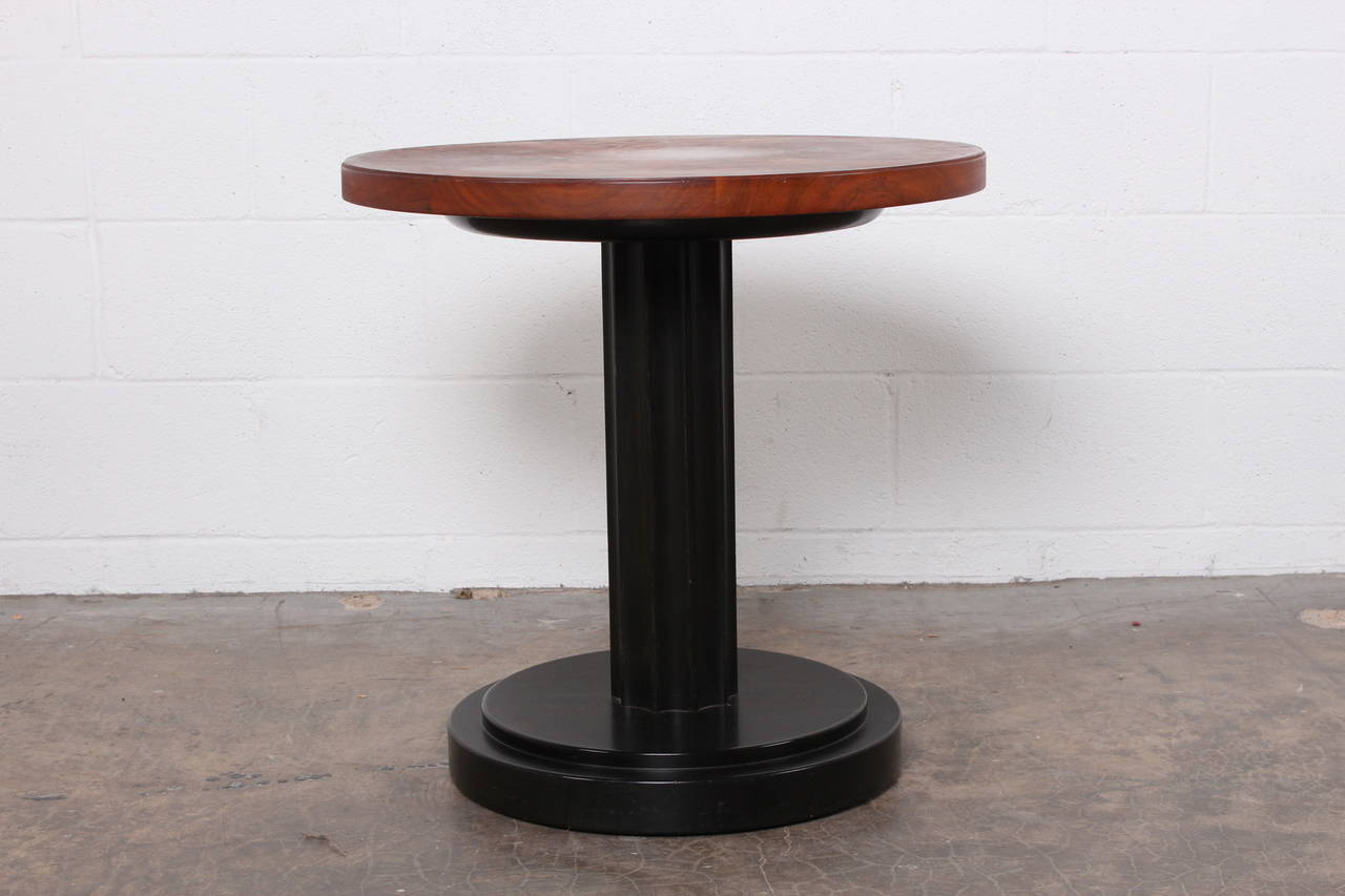 An early side table with mahogany base and beautifully grained top. Designed by Edward Wormley for Dunbar.