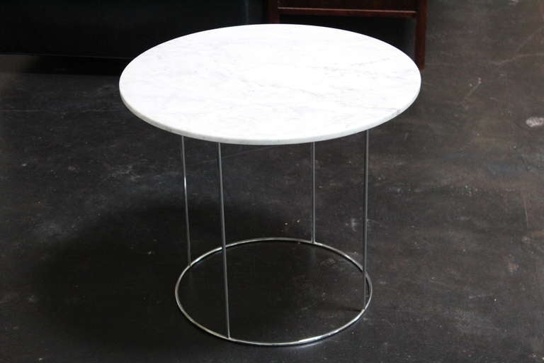 Chrome table with Carrera marble top. Designed by Hugh Acton.