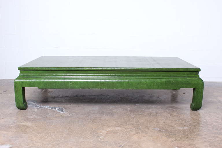 A large linen covered coffee table with green lacquer. Designed by Karl Springer.