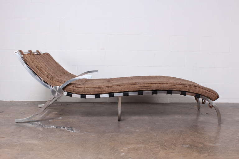 A very stylish aluminum chaise lounge with rubber strapping.