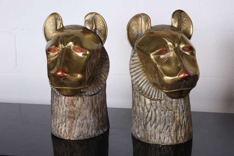 A pair of well crafted bronze tiger heads signed Rudolph.