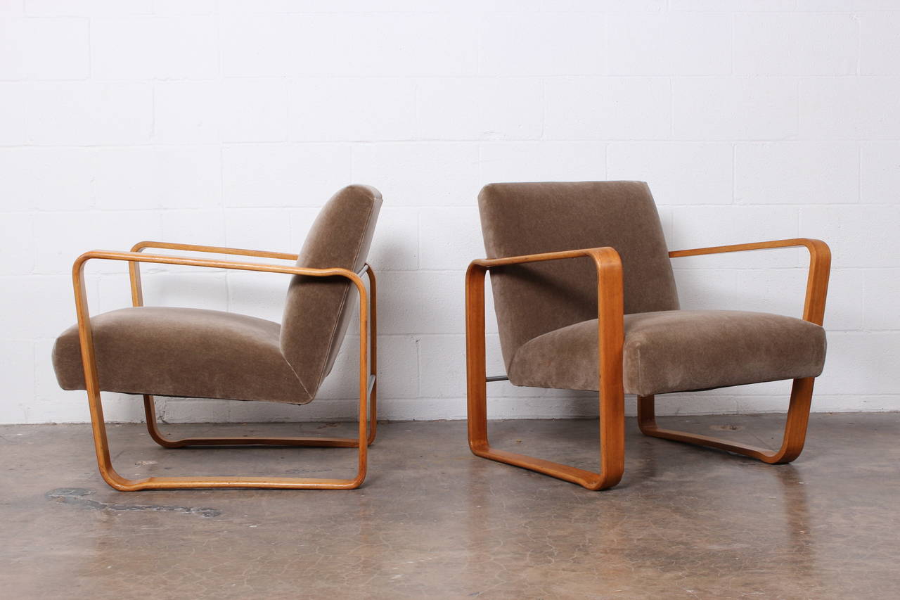 A rare pair of bleached mahogany and mohair tank lounge chairs designed by Edward Wormley for Dunbar.