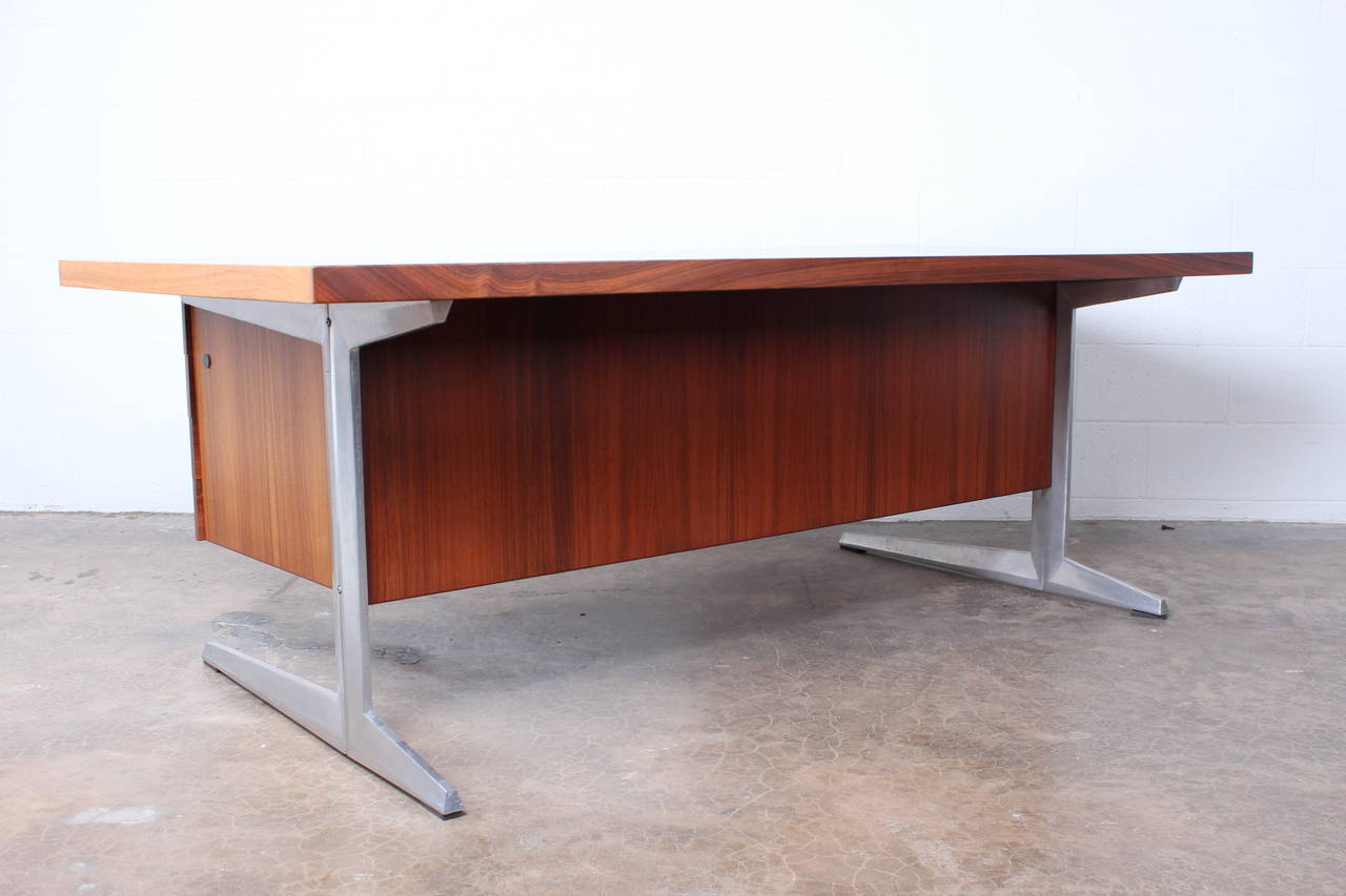 A danish rosewood desk with aluminum base and tambour rosewood credenza. 

desk: 79 x 39.5 x 28.5(h)
credenza: 72 x 17.75 x 30.5(h)