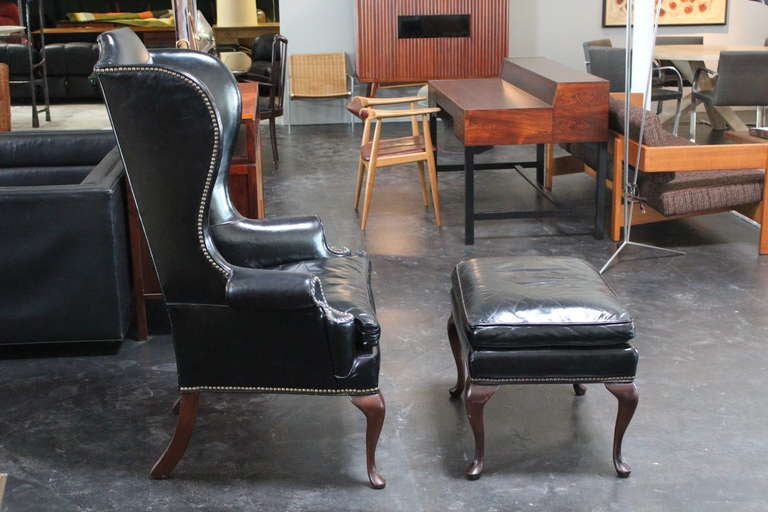 Beautifully Patinated Leather Wingback Chair and Ottoman In Good Condition In Dallas, TX
