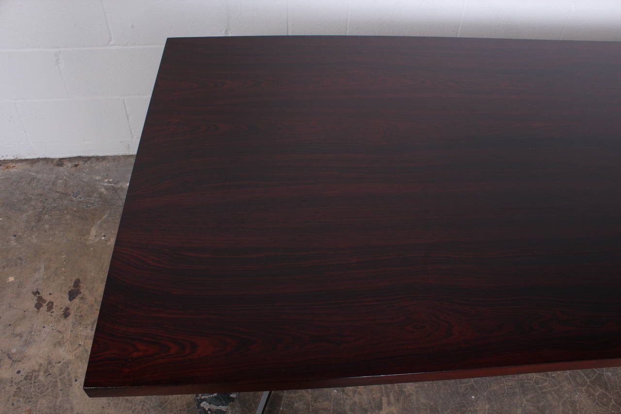 A rare desk in cast aluminum with rosewood top. Designed by Ward Bennett for Lehigh Furniture.