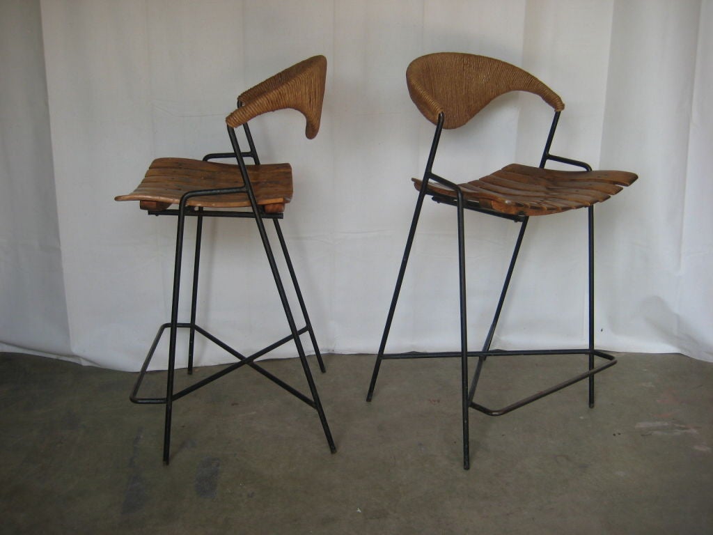 A set of four counter hight barstools designed by Arthur Umanoff for Raymor.