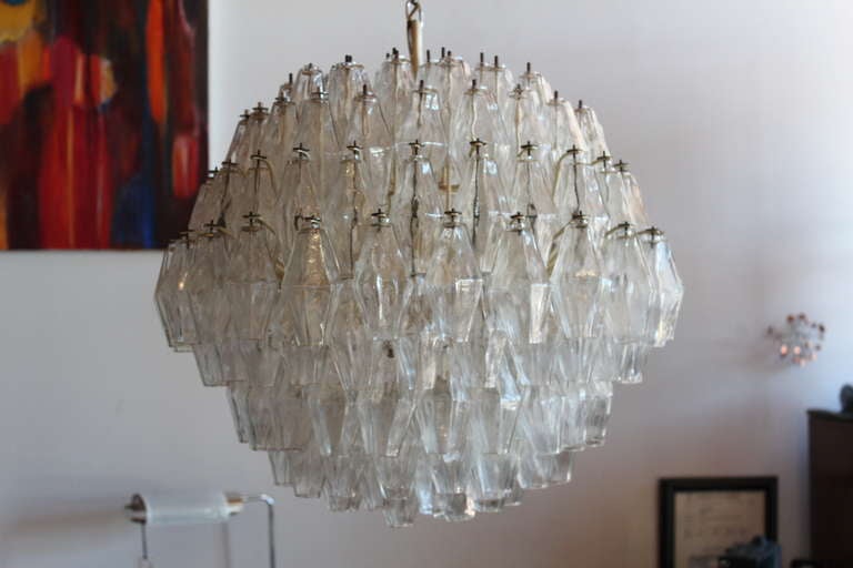 This large example consists of 152 pieces of glass and holds 8 bulbs.