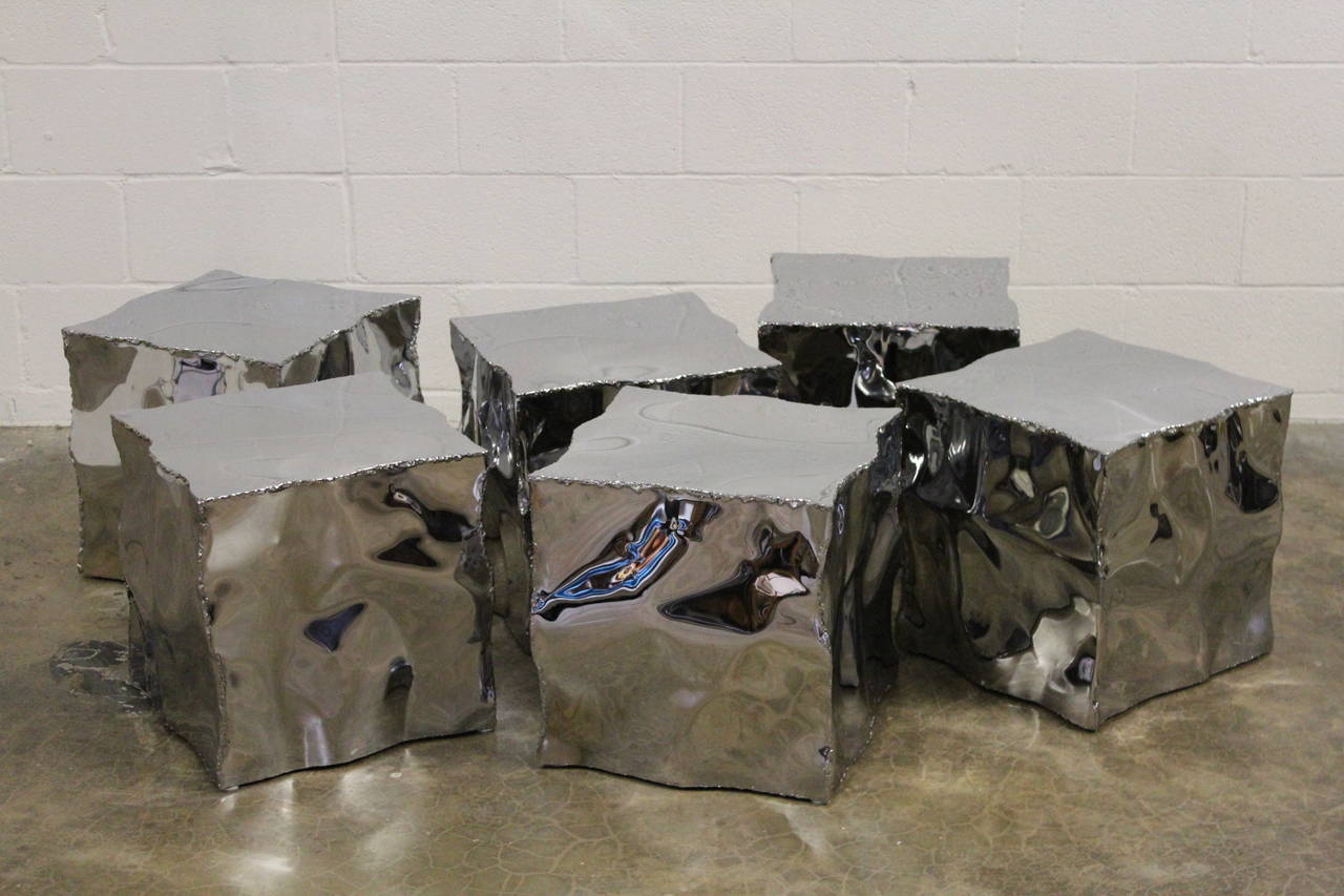 A set of six hand sculpted tables that can also be used as benches or as a coffee table. Priced and sold individually.