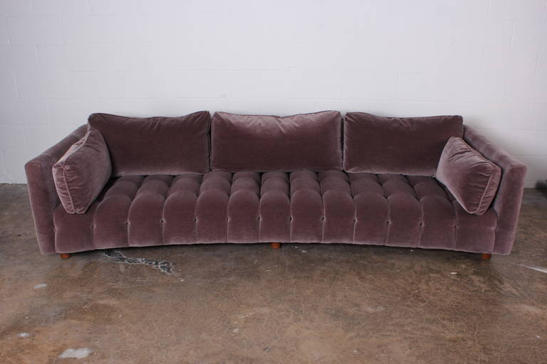 A curved sofa with channeled seat and down cushions designed by Harvey Probber. Fully restored with mohair upholstery.