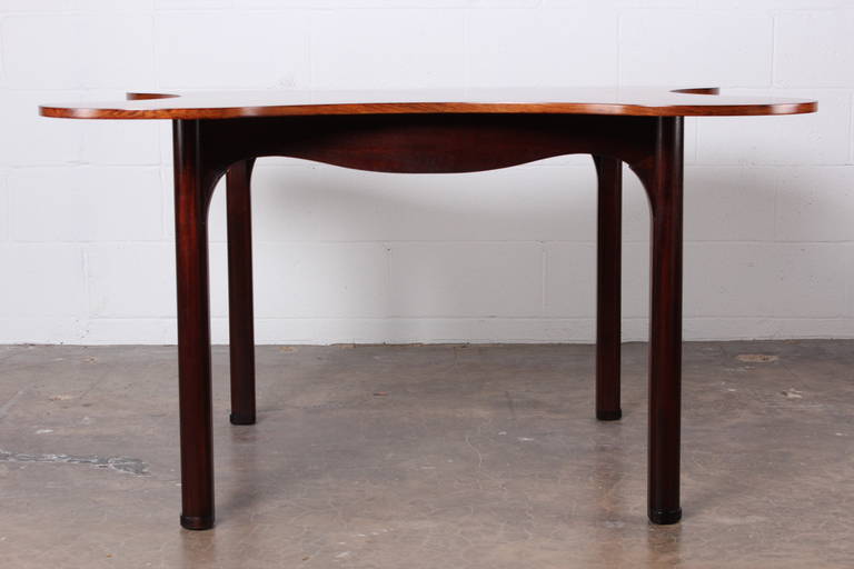 The clover game table in rosewood and mahogany by Edward Wormley for Dunbar.