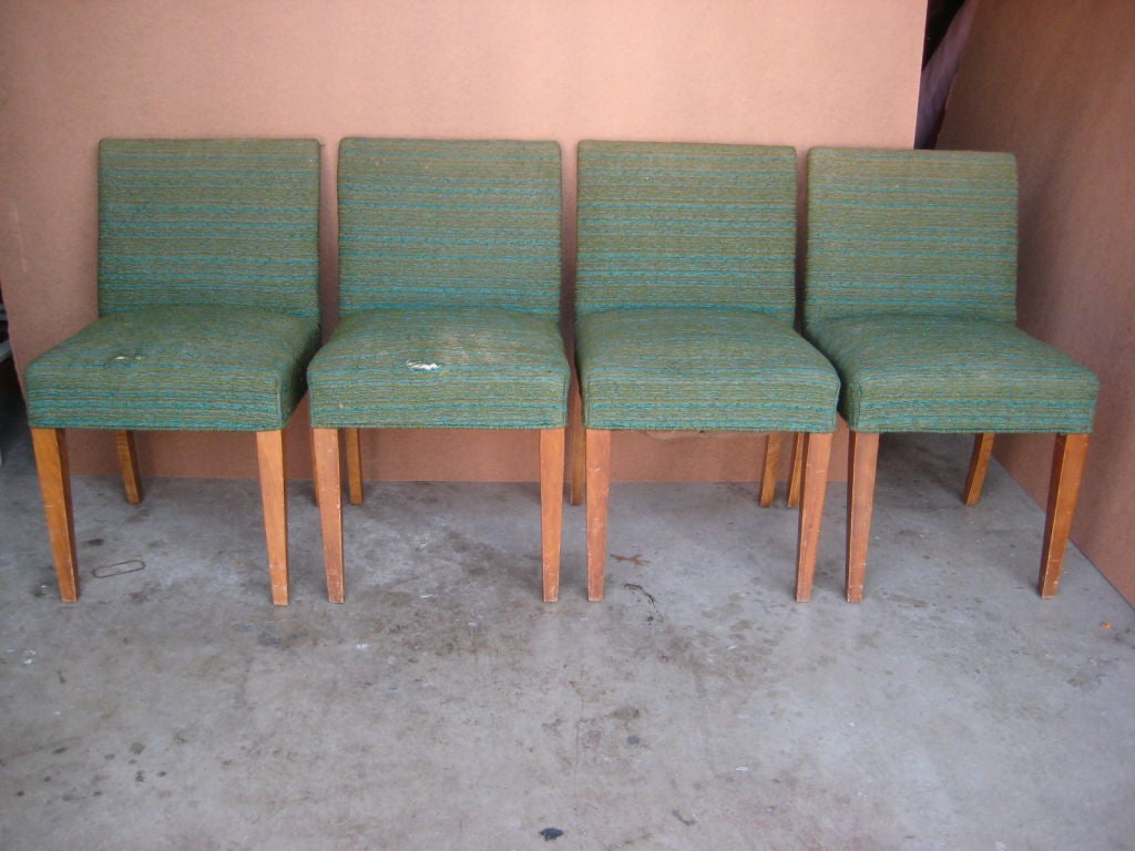 A very nice set of four dining chairs in the style of TH Robsjohn-Gibbings or Parzinger.