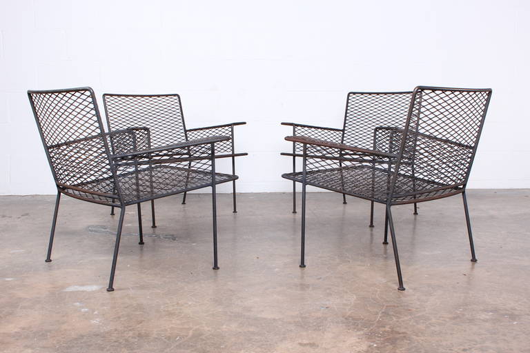 A set of four outdoor armed lounge chairs designed by Van Keppel-Green.
