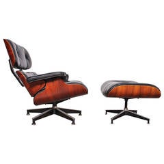 Rosewood Lounge Chair and Ottoman by Charles Eames